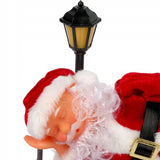 Raudona animuota Kalėdų Senelio figūrėlė su garsu ir apšvietimu